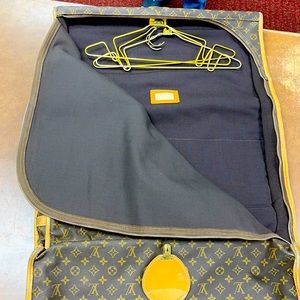 Louis Vuitton Saks with Avenue garment bag.
